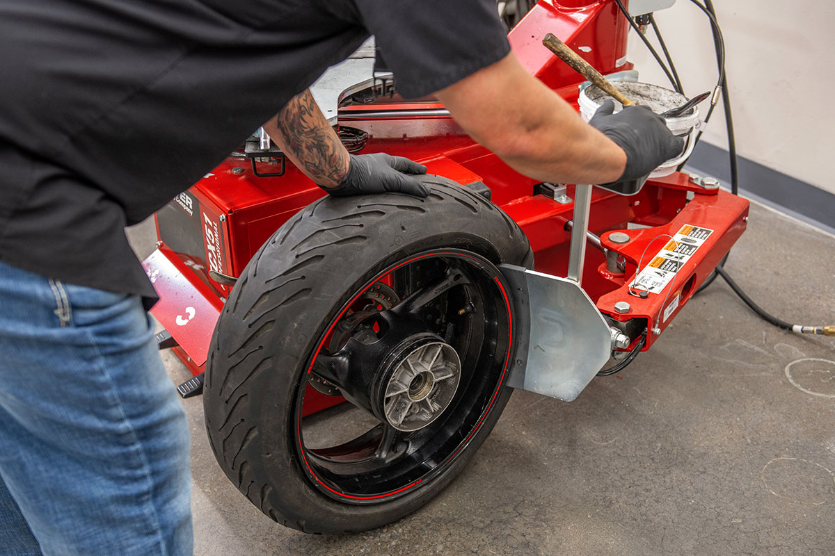 motorcycle-realshop-cyclegear04.jpg hunter motorcycle wheel service with smartweight pro wheel balancer and tcx table-top tire changer at cycle gear