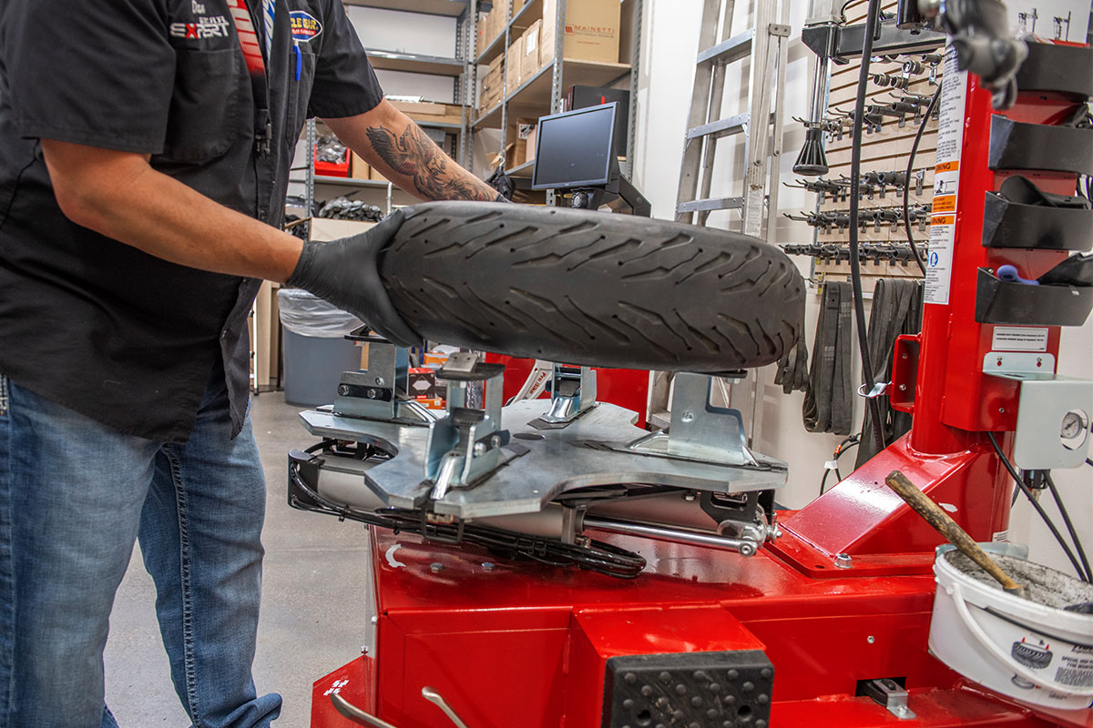 motorcycle-realshop-cyclegear05.jpg hunter motorcycle wheel service with smartweight pro wheel balancer and tcx table-top tire changer at cycle gear