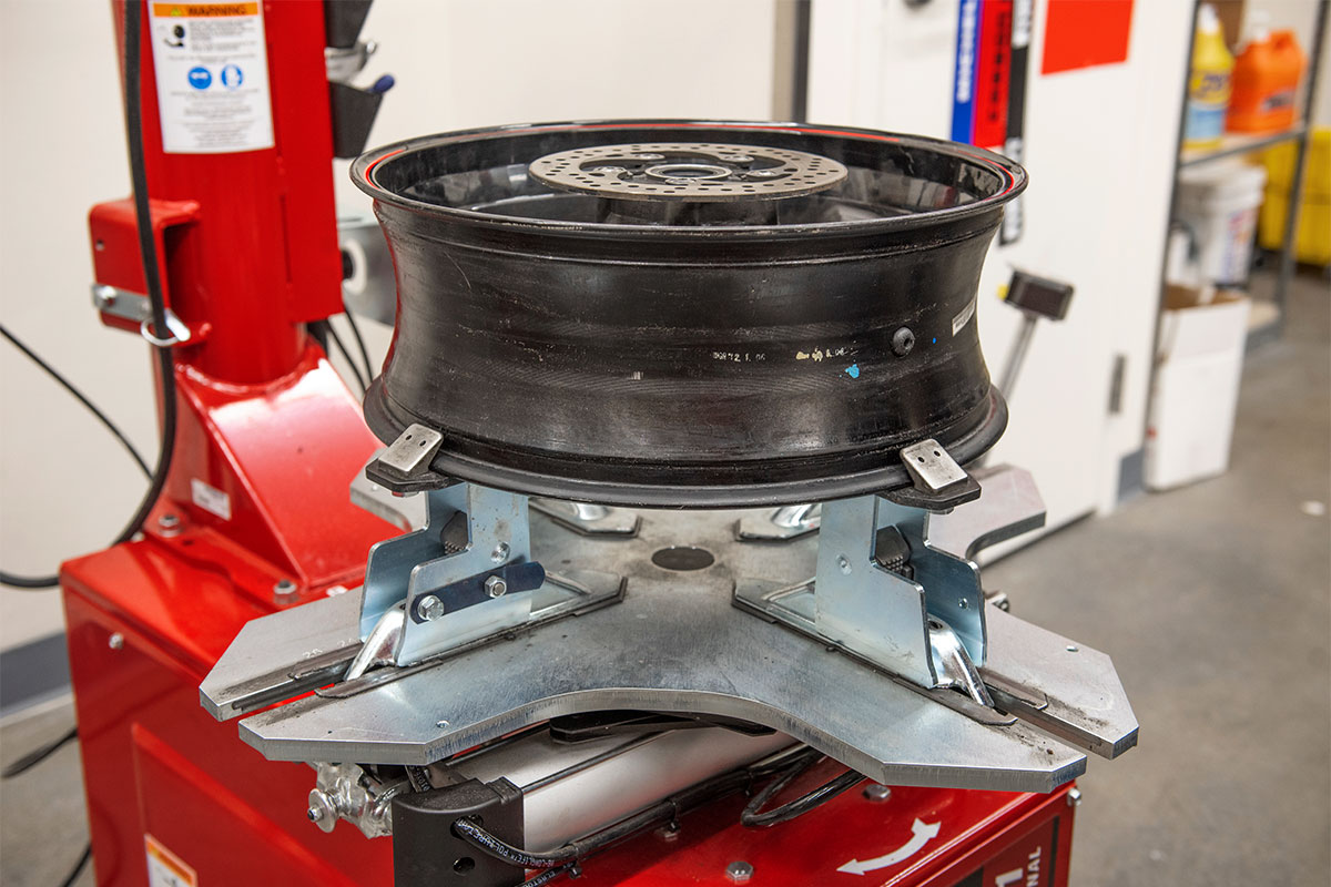 motorcycle-realshop-cyclegear08.jpg hunter motorcycle wheel service with smartweight pro wheel balancer and tcx table-top tire changer at cycle gear