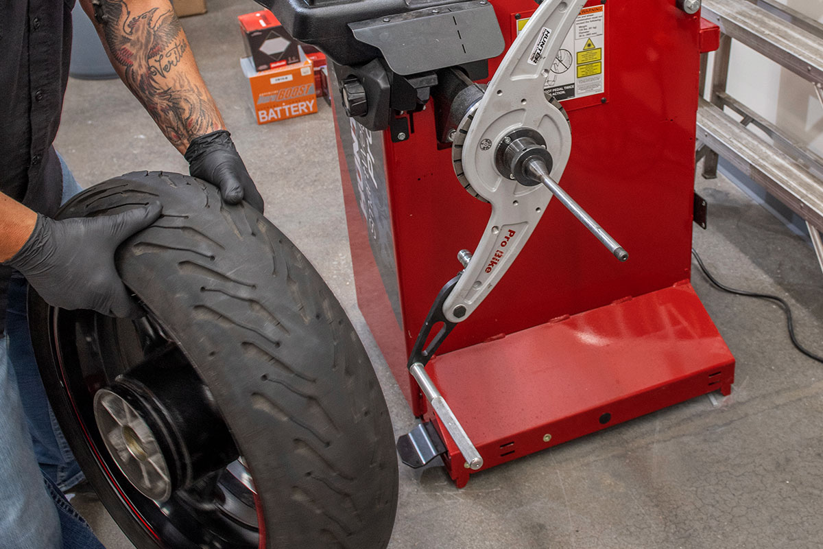 motorcycle-realshop-cyclegear16-cropped.jpg hunter motorcycle wheel service with smartweight pro wheel balancer and tcx table-top tire changer at cycle gear