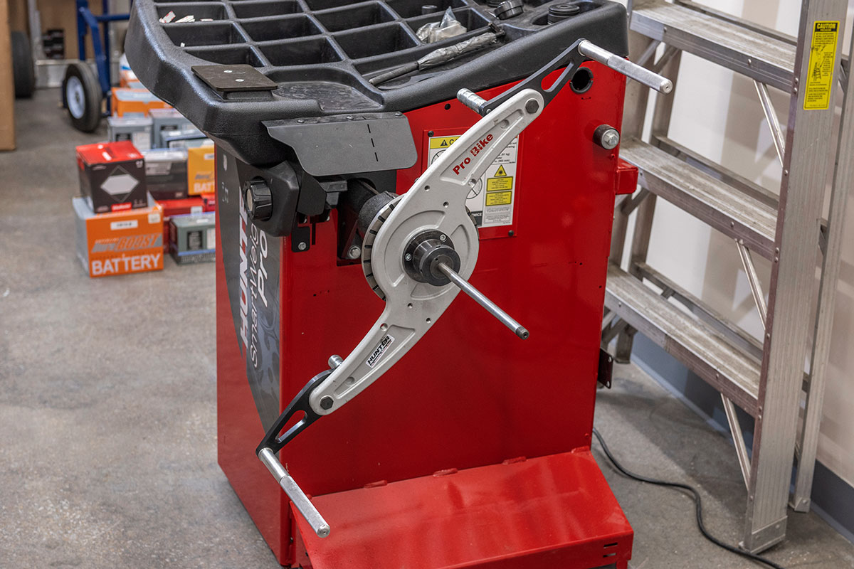 motorcycle-realshop-cyclegear21.jpg hunter motorcycle wheel service with smartweight pro wheel balancer and tcx table-top tire changer at cycle gear