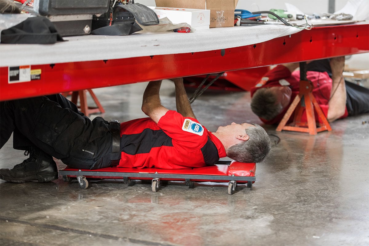 rack-l45x-install-hemannautomotive3.jpg service rep under four post lift installing