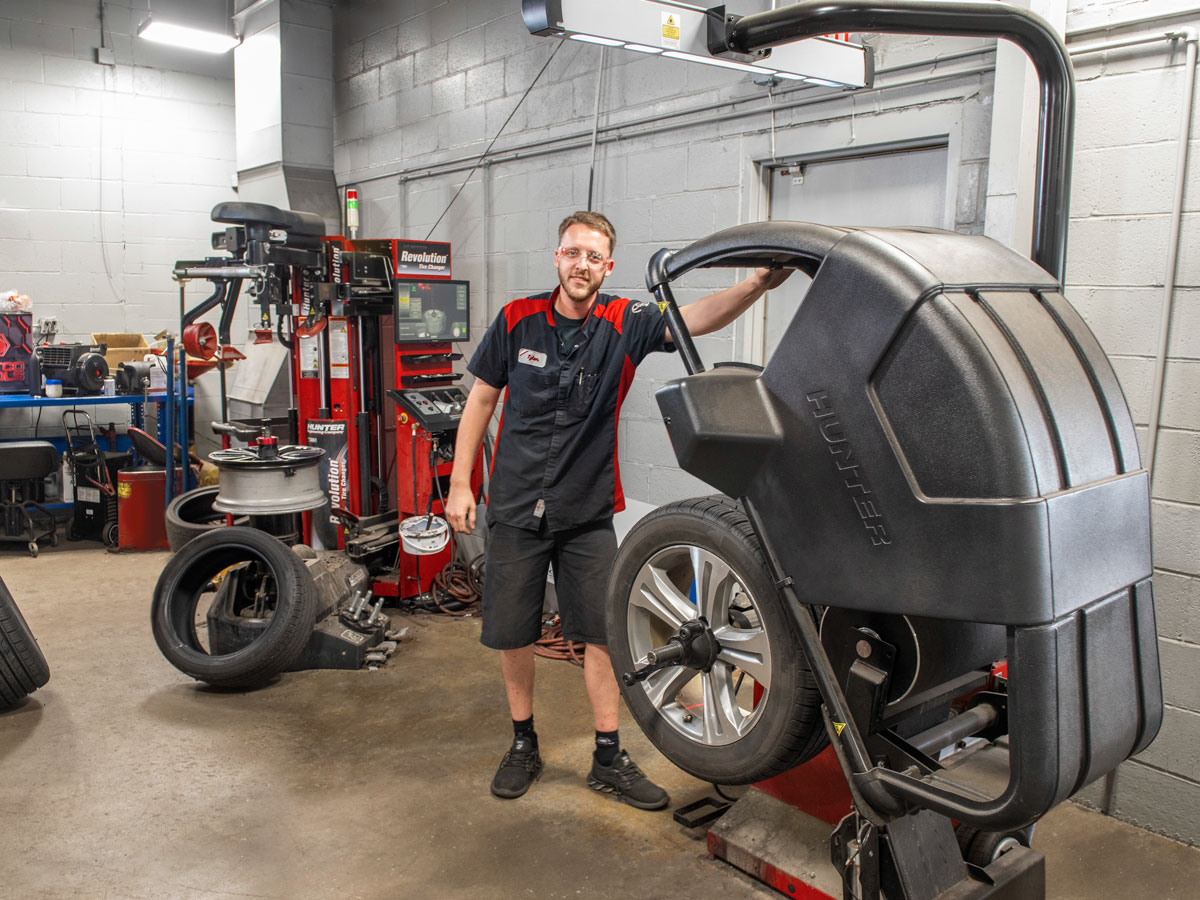automotive technician using hunter equipment